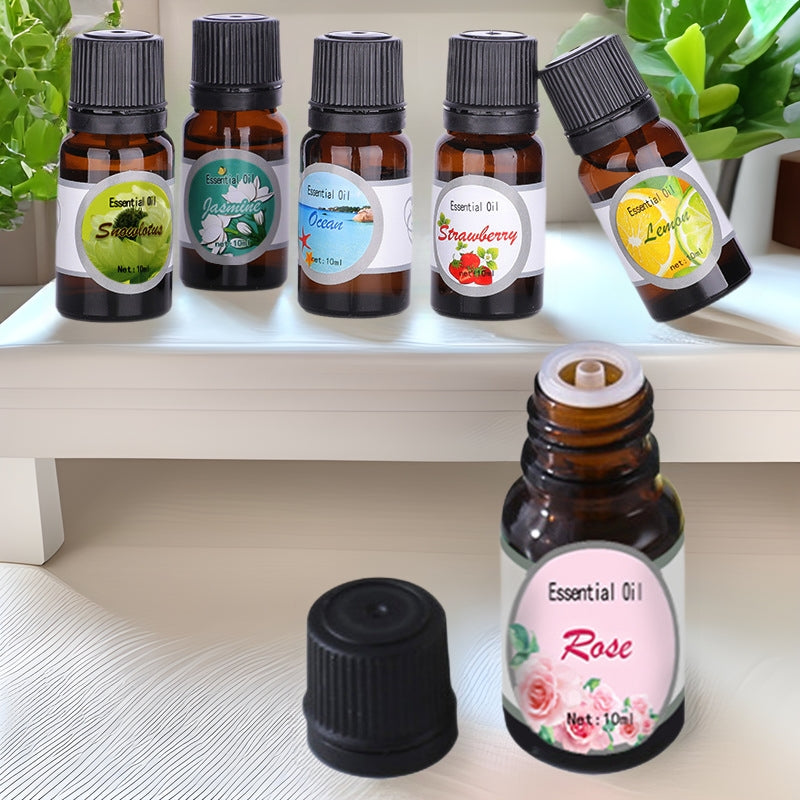Frascos de aceite aromático Dozze de 10 ml sobre una estantería, con el frasco de rosa destapado