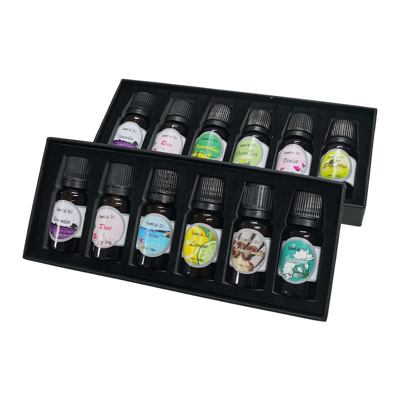 Dos cajas de aceites aromáticos Dozze abiertas con seis frascos de 10 ml cada una
